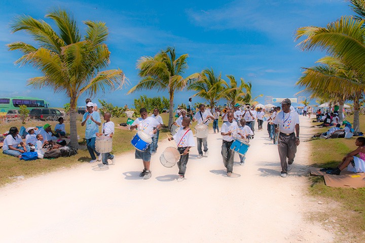 local school band marching through the streets of Schooner Bay on a sunny spring day on south Abaco, Bahamas