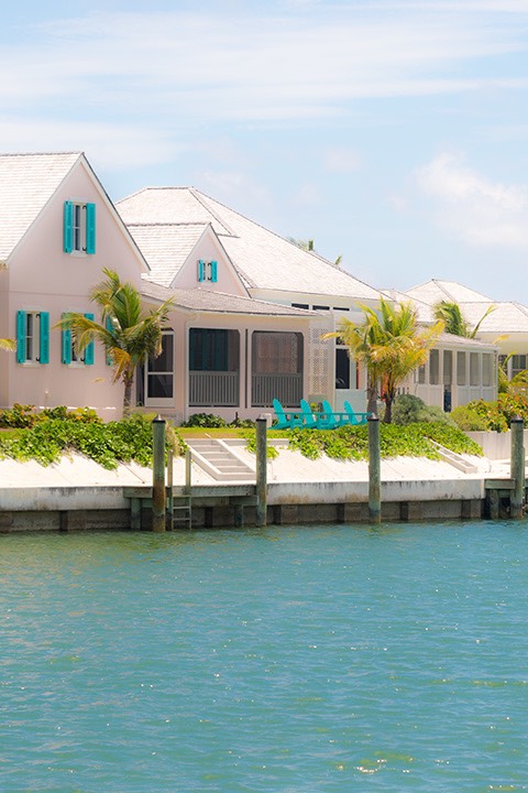 Schooner Bay cottages overlooking the seawall on the harbour island